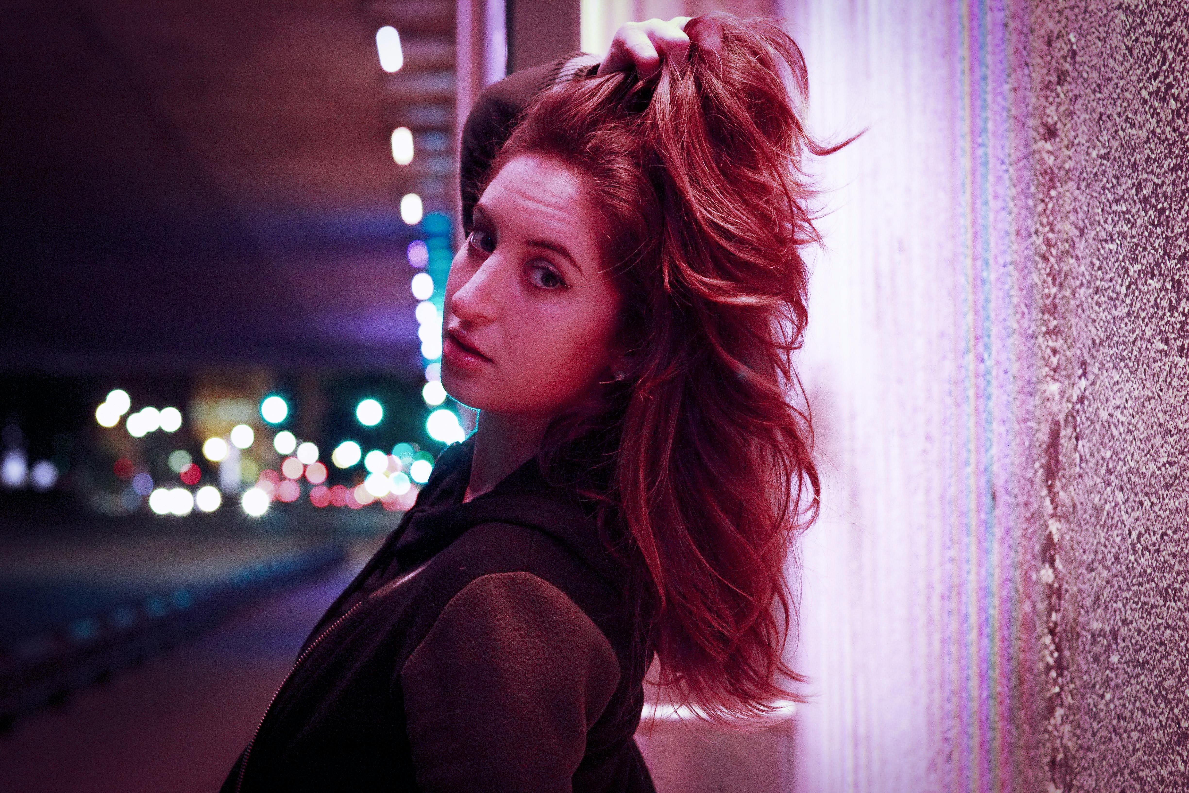 woman leaning on wall