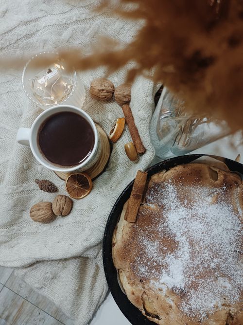 Free Warm beverage and cinnamon cake flat lay with walnuts, perfect for cozy autumn vibes. Stock Photo