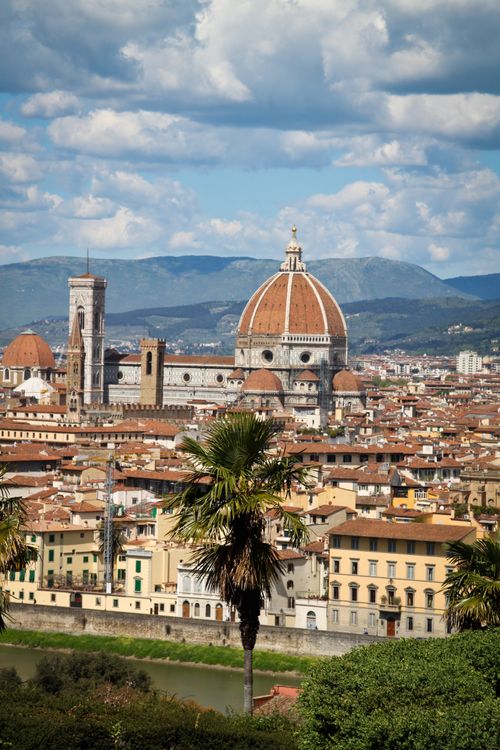 Free Breathtaking drone shot of Florence showcasing the iconic cathedral and cityscape under a vibrant sky. Stock Photo