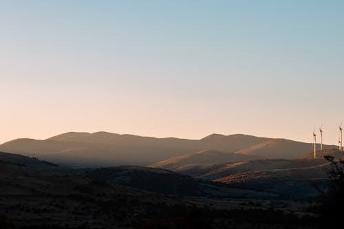 Безкоштовне стокове фото на тему «Захід сонця, краєвид, пагорби»