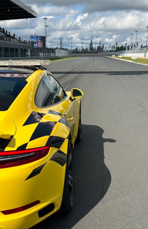Yellow Magic Racing Yellow Race Car Speeding on Track · Free Stock Photo