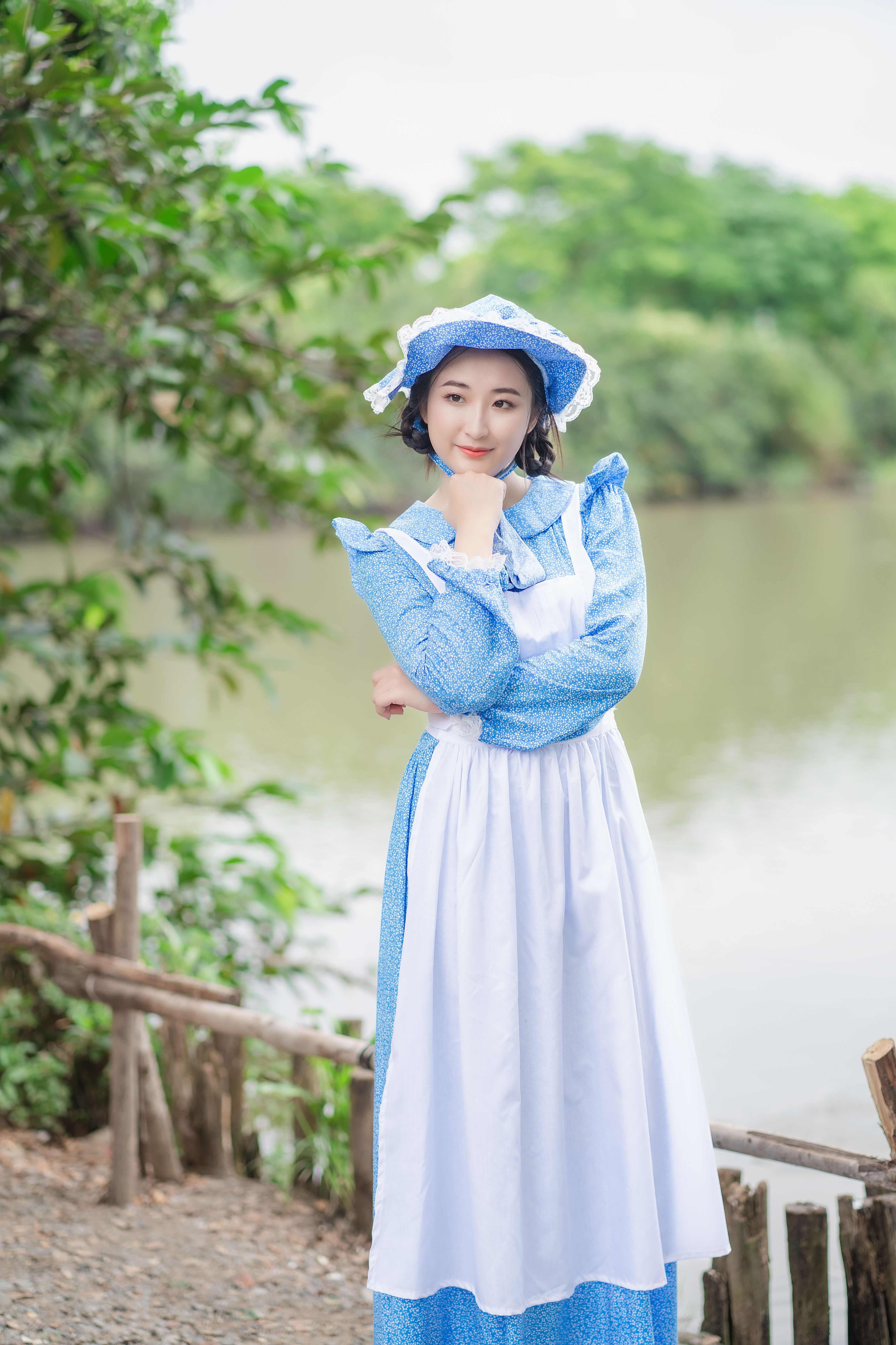 Portrait of Woman in Blue Dress with Apron  Free Stock Photo