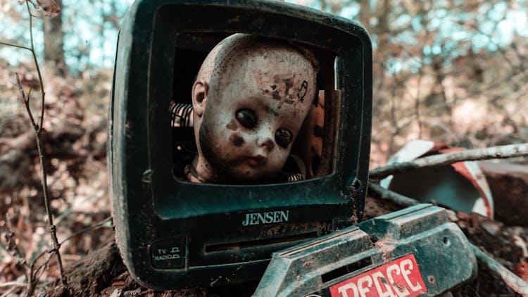 Close Up Of A Doll Head In A Box