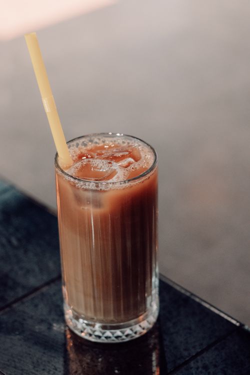 Free Chilled iced coffee served in a glass with a straw, perfect for a refreshing pick-me-up. Stock Photo