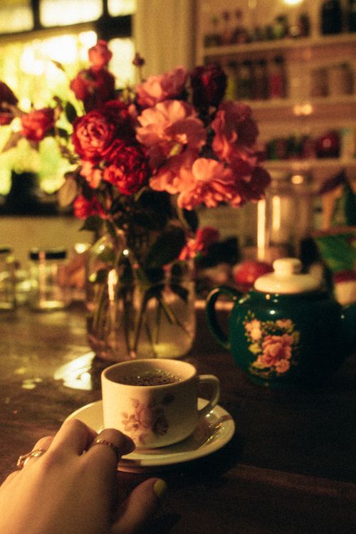 Free Warm, inviting scene of tea and flowers in a cozy indoor setting. Stock Photo