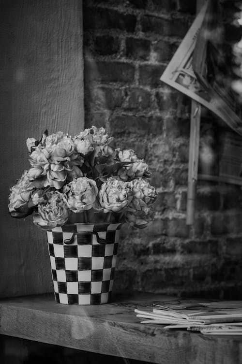 Bunch of Flowers in a Bucket on a Table 