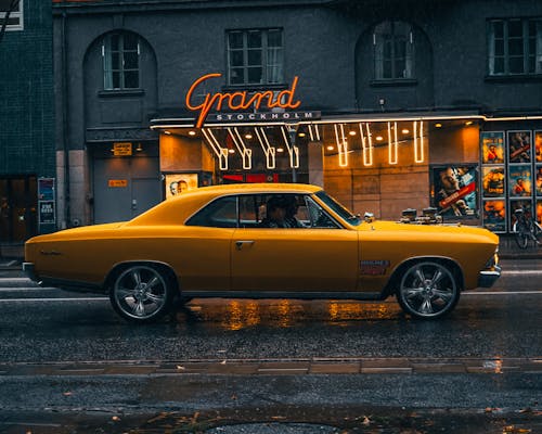 Vintage Yellow Car on City Street