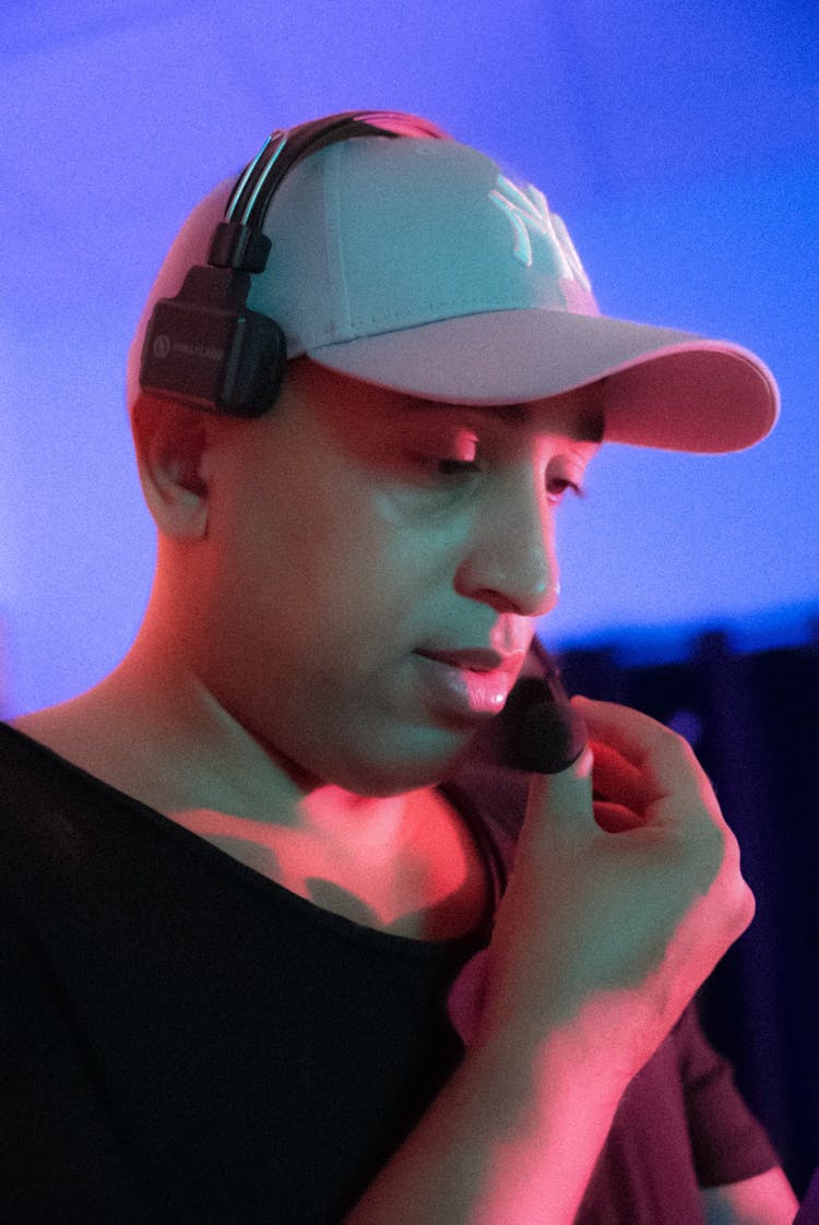 Young Man Wearing A Headset With A Microphone 