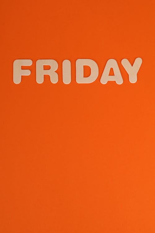 Free Friday Word on Orange Background Stock Photo