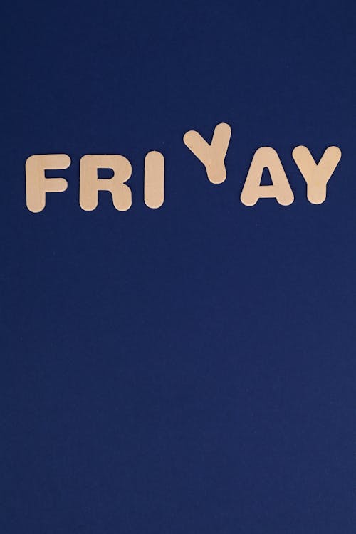 Free Pink Friyay Text on a Blue Background Stock Photo
