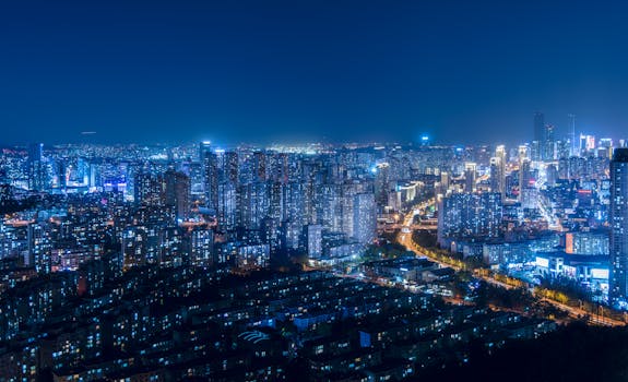 A breathtaking cityscape with illuminated skyscrapers and vibrant urban lights during the night.