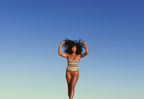 Woman in Swimsuit under Clear Sky