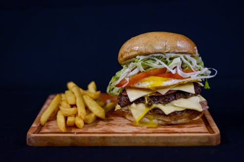 Double Cheeseburger and Fries on a Cutting Board