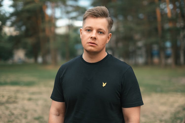 Man Posing In Black Lyle Scott T-Shirt