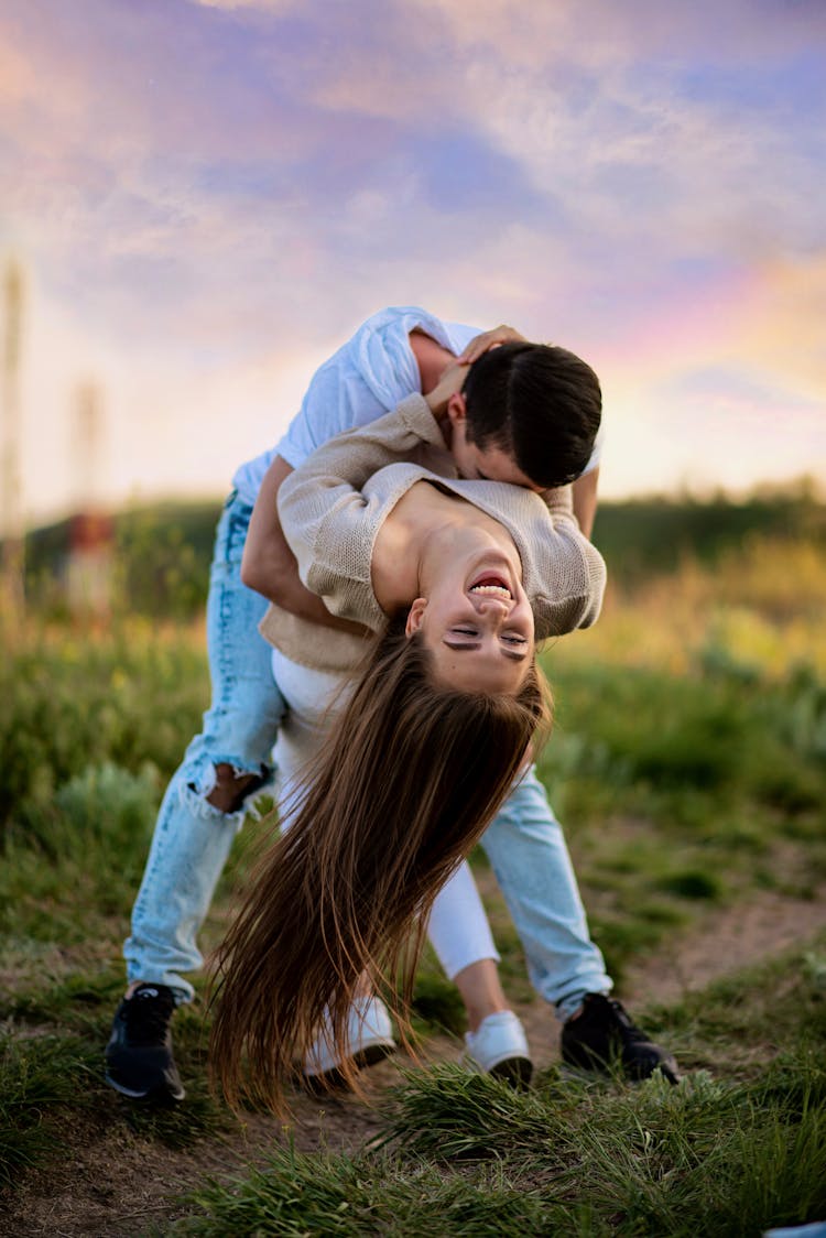 Man Sweeping Woman Off Her Feet