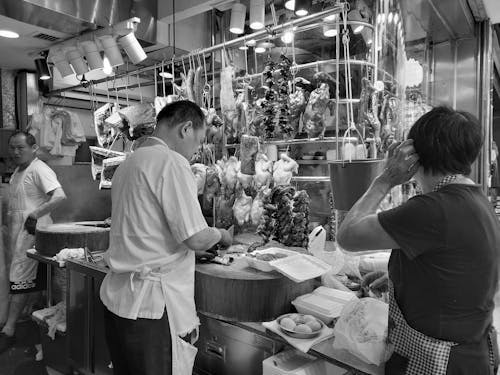People Preparing Food in a Restaurant Kitchen