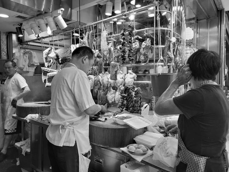 People Preparing Food In A Restaurant Kitchen