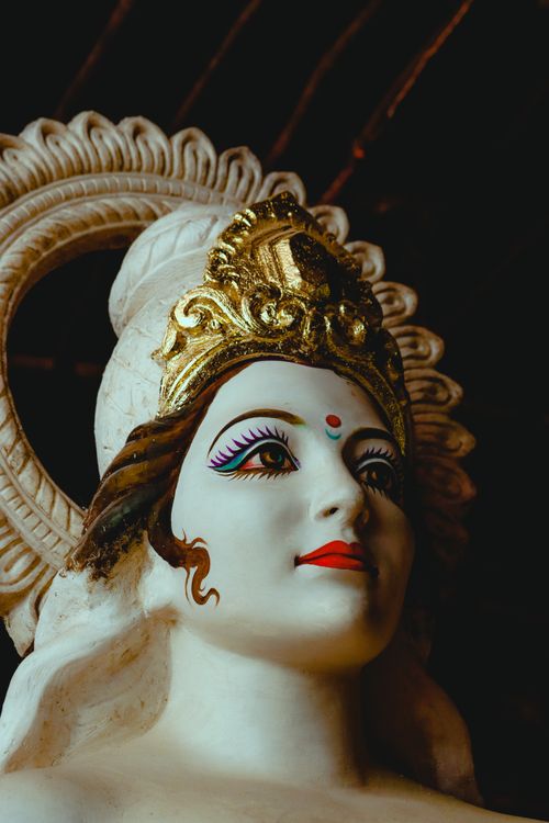Free Close-up shot of a Hindu goddess statue with intricate crown and vibrant colors in Mumbai, India. Stock Photo