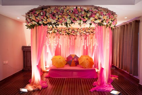 Umbrellas and Flowers Decoration of Wedding Bed