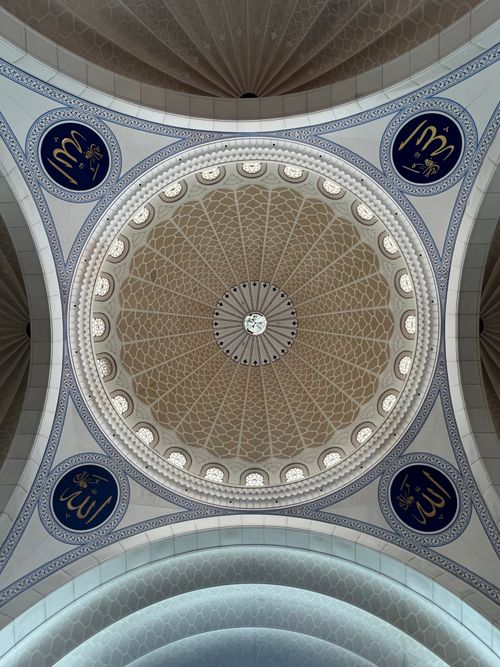 Free A vertical shot of the beautifully ornate dome of the Federal Territory Mosque in Kuala Lumpur, Malaysia. Stock Photo