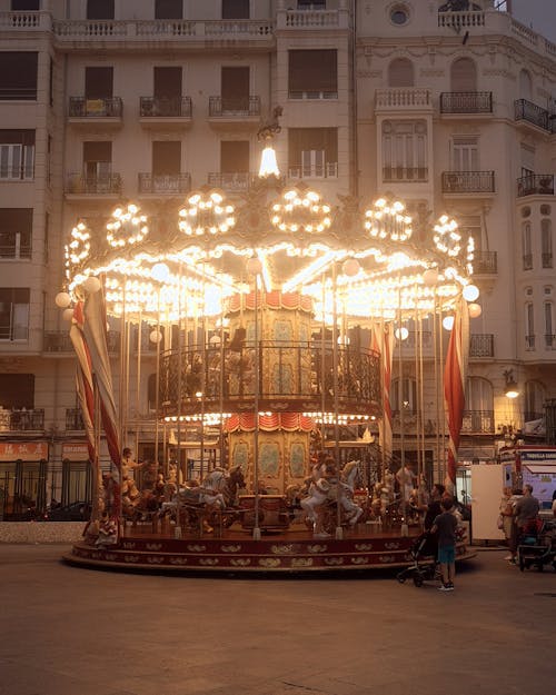 Illuminated Carousel in City 