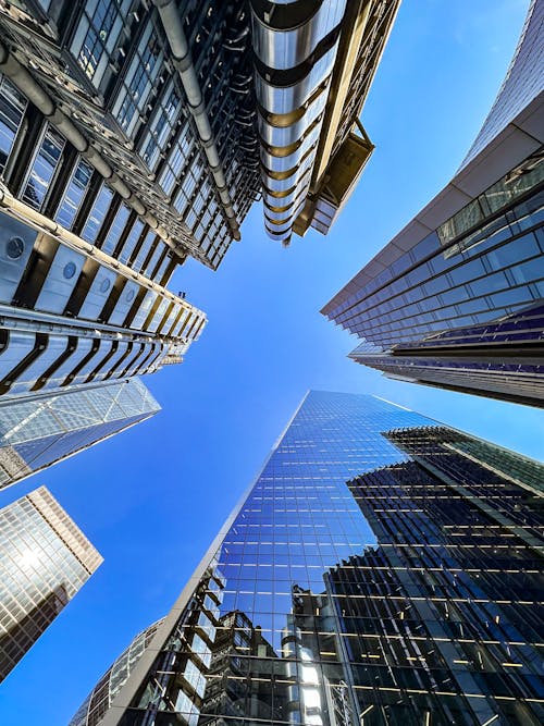 Low Angle Shot of Modern Skyscrapers under Blue Sky 