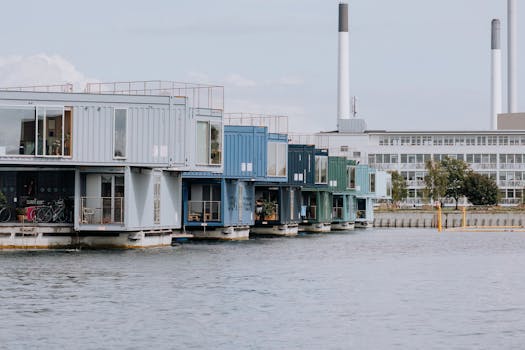 Innovative container homes on water, showcasing modern urban living in Copenhagen's harbor.