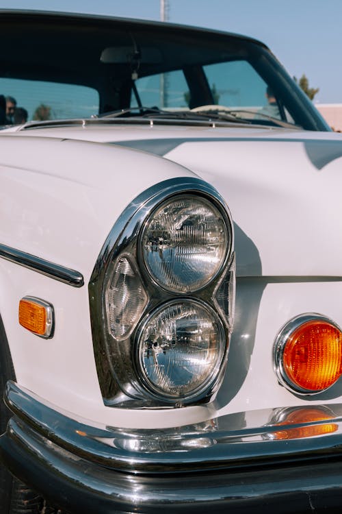 Headlights of a White Vintage Car 