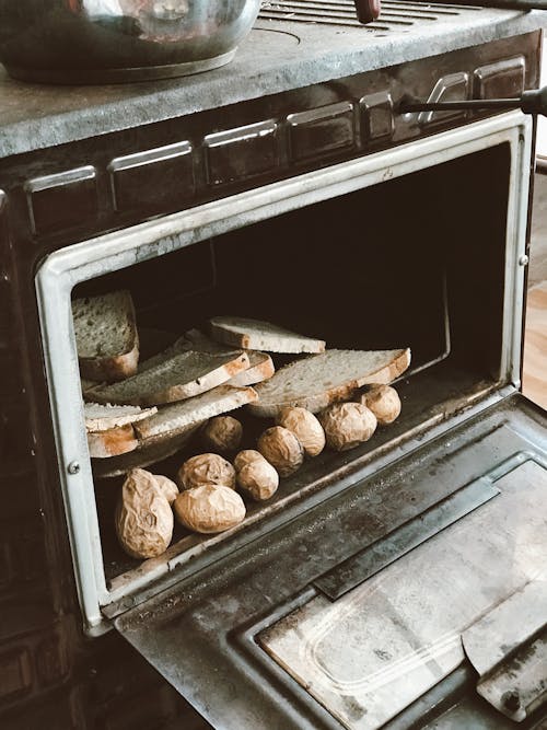 Slices of Bread and Potatoes in the Oven