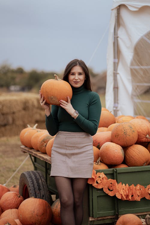 Woman by the Pumpkin Cart