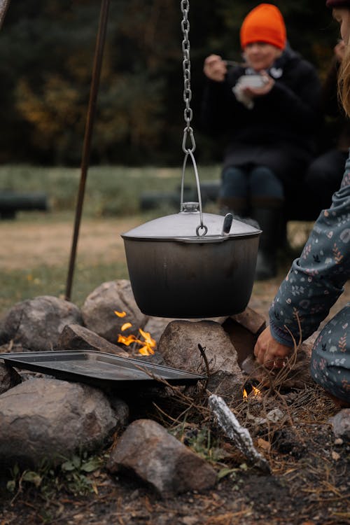 Metal Pot Hanging over a Campfire