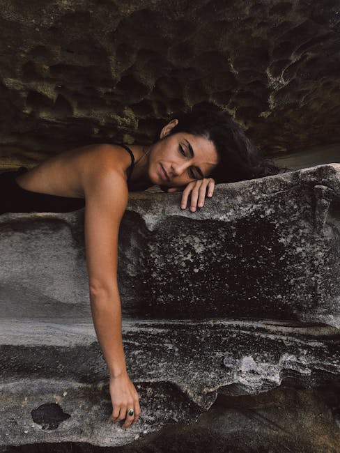 Woman Lying on Rock