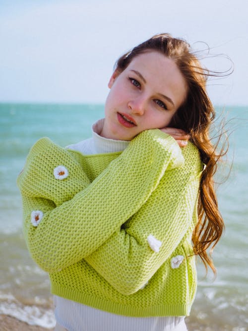 Model in Cropped Lime Knitted Sweater on the Beach