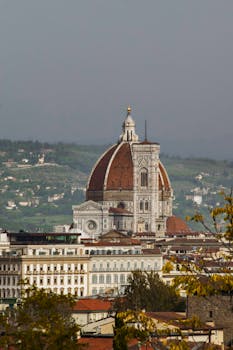 Stunning view of Florence Duomo amid vibrant autumn colors.