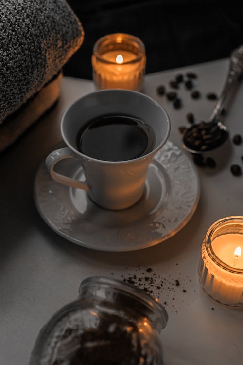 Coffee Cup and Candles on Table