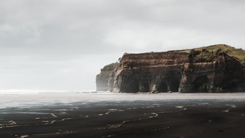 Photo Of Rock Formation On Sea Side