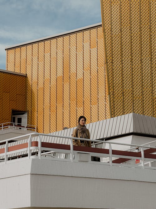 Woman in a Coat and Scarf on the Terrace of the Berliner Philharmonie