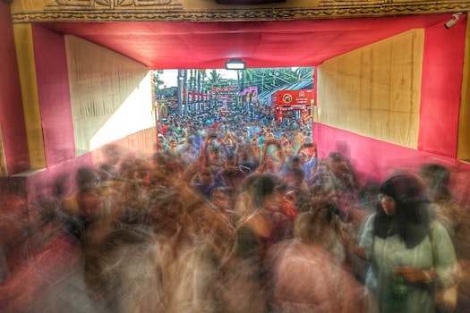 Colorful and bustling scene of Durga Puja festivities in Kolkata, India, with a dynamic crowd.