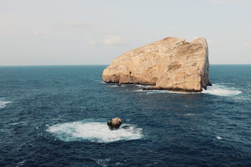 Free Turquoise Seascape with Rocks Stock Photo