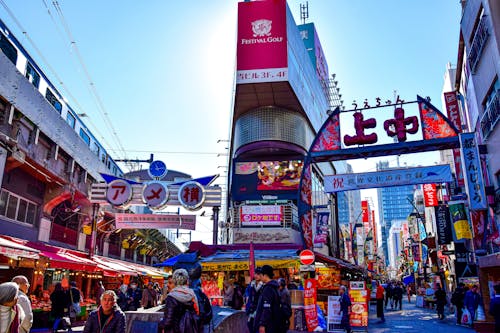 Commercial Street with an Outdoor Market and Japanese Scripts