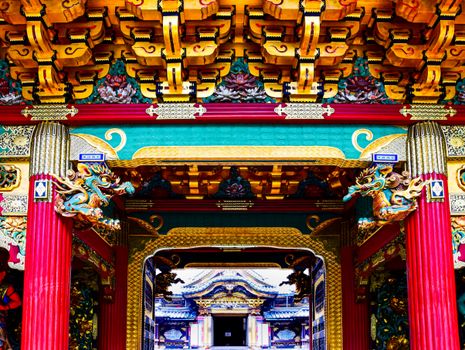 Vibrant and intricately designed temple gate showcasing traditional Asian architecture with dragon decorations.