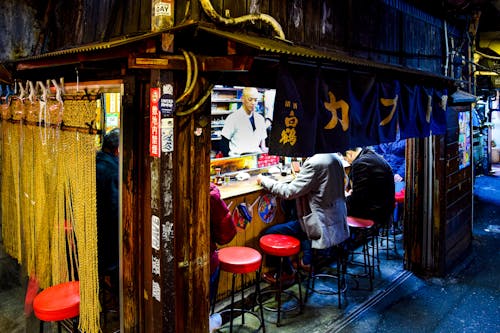 People Eating at a Street Cafe at Omoide Yokocho Alley, Shinjuku, Tokyo