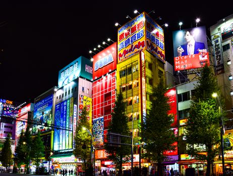 Colorful illuminated billboards in Akihabara district, Tokyo at night.