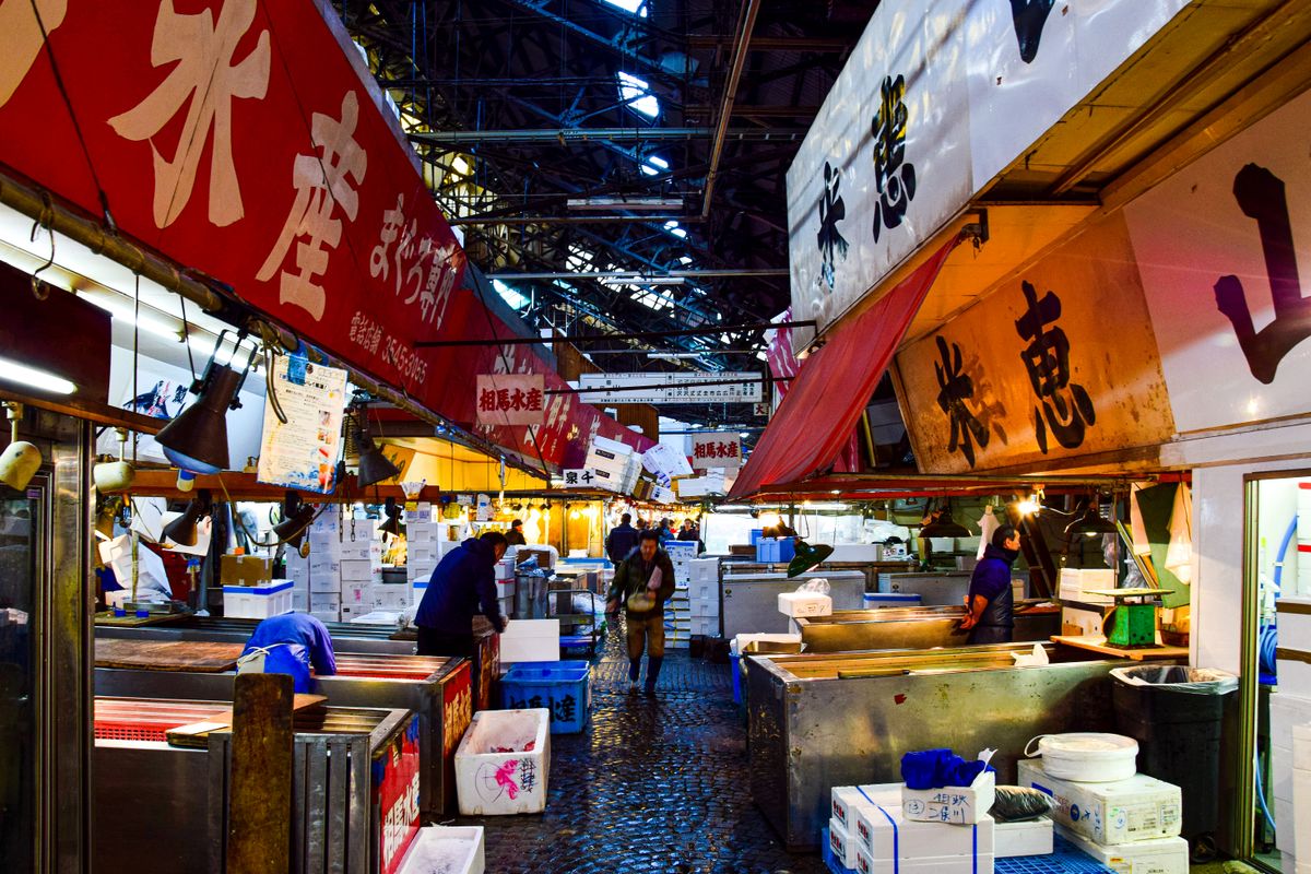 Tsukiji Outer Market at dawn — the finest food market experience in Tokyo.