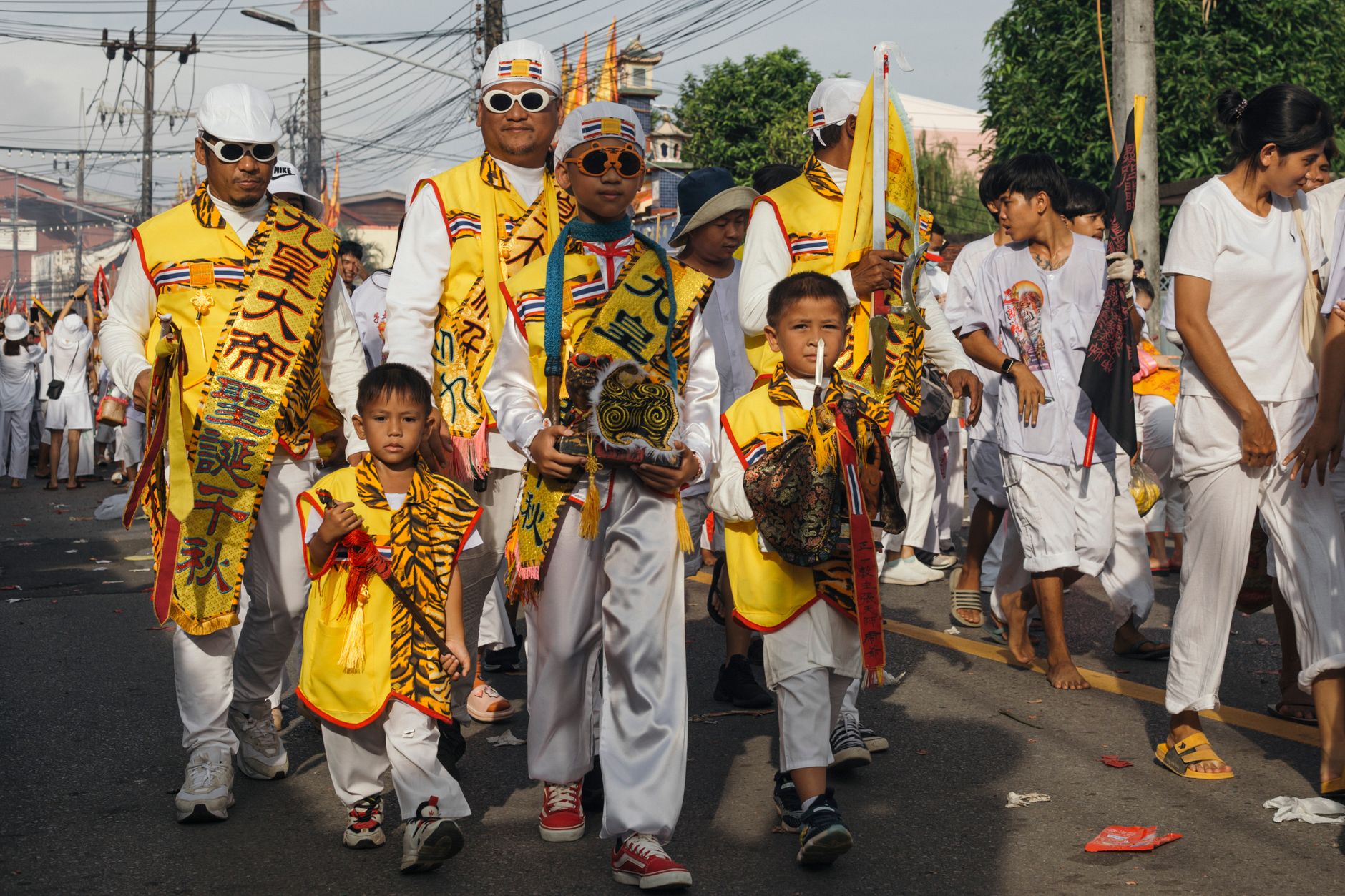 A vibrant parade celebrating Thai culture with traditional costumes and music.