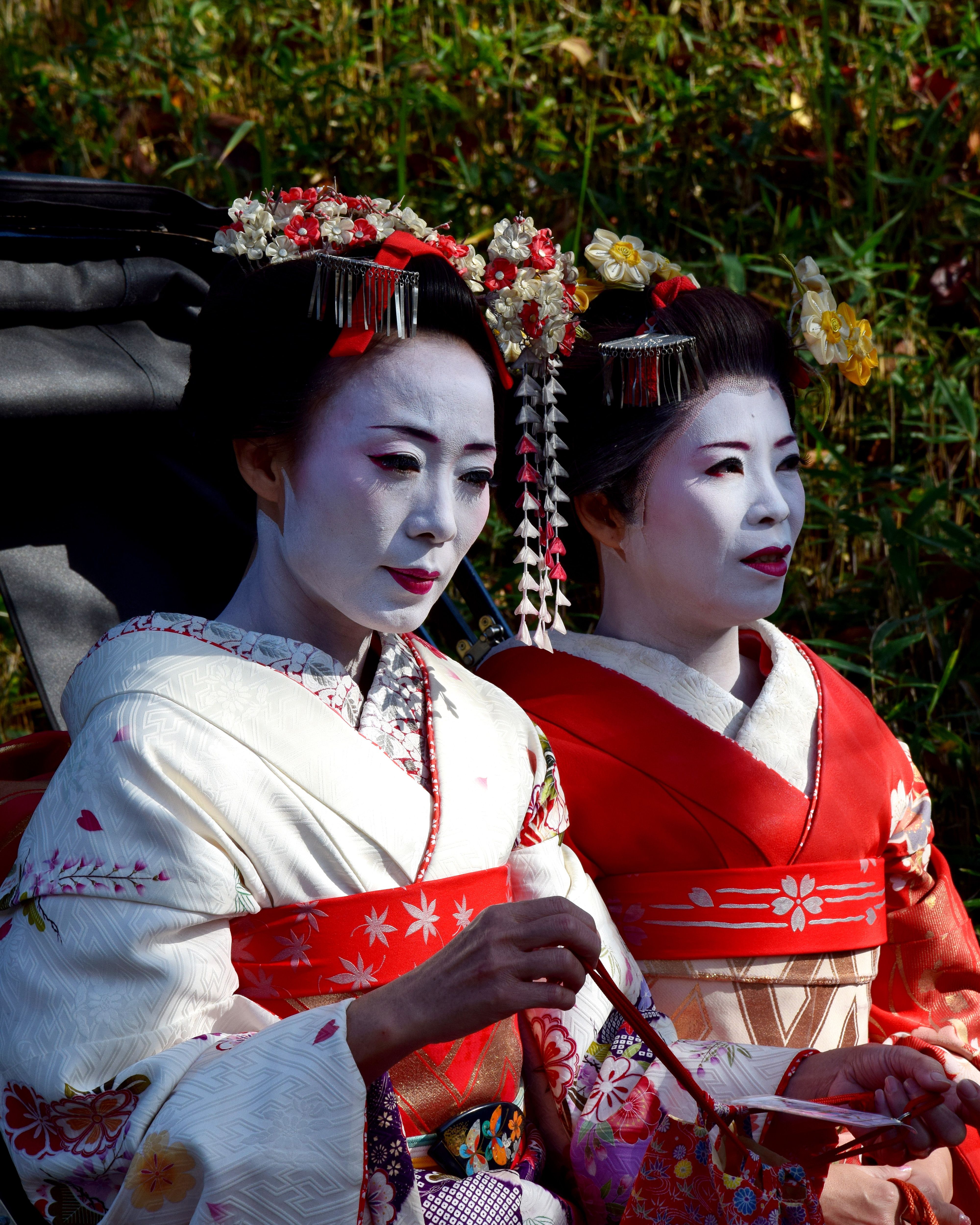 Two Geisha in Formal Kimonos Standing Outside · Free Stock Photo