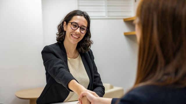 Candidate shaking hands with a manager after a job interview