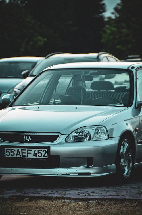 A Silver Honda Civic on a Parking Lot 