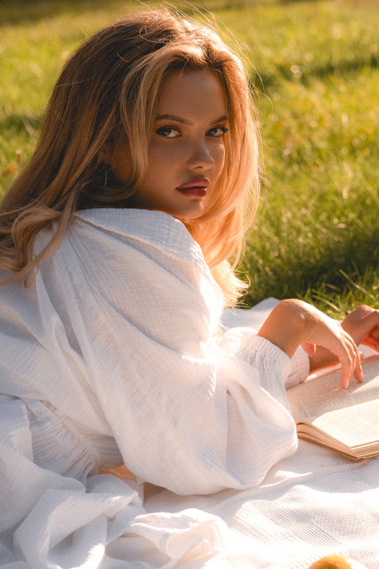 Beautiful Blonde Woman With Book At Picnic