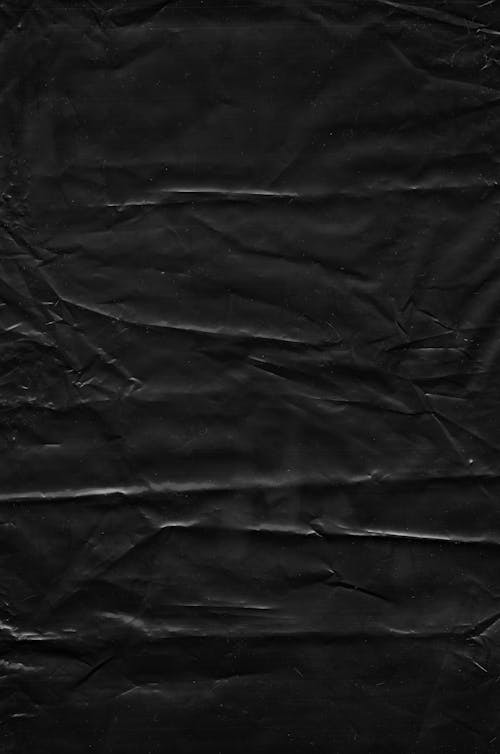 A Black Creased Fabric Background 